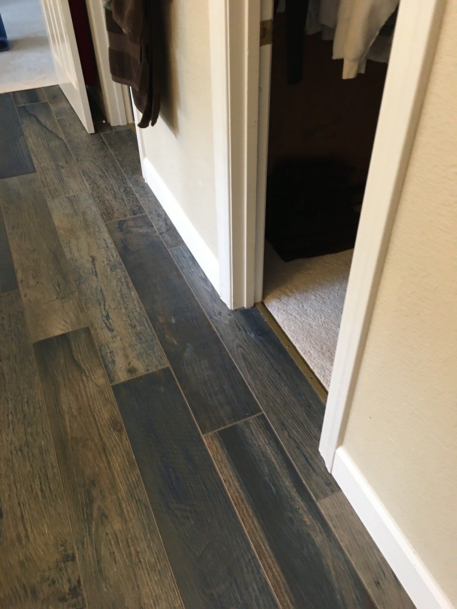 Finished wood-look bathroom tile flooring